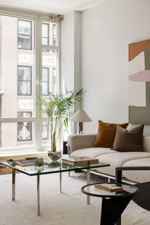 a living room with furniture and windows