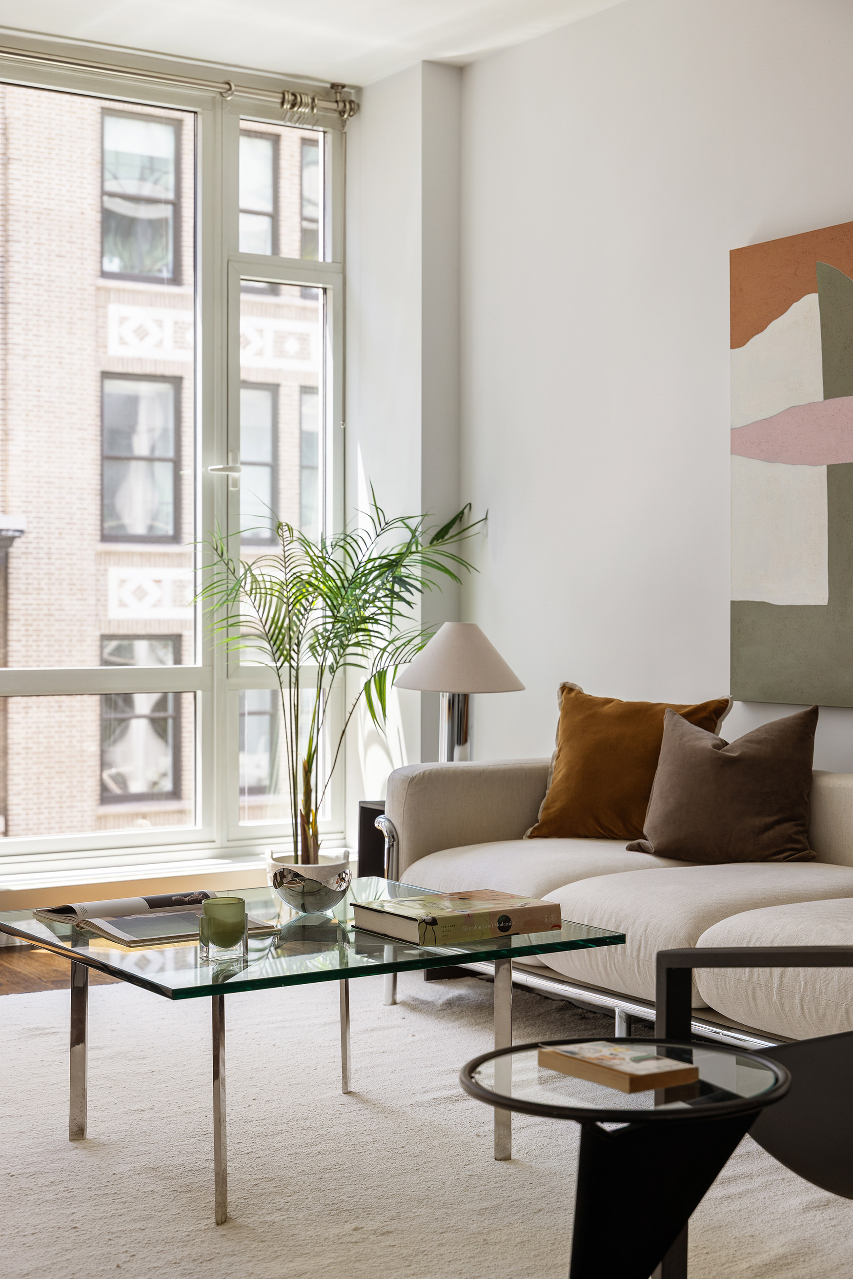 133 West 22nd Street, Unit 8C Manhattan, NY 10011 - Photo 2 of 11 a living room with furniture and windows