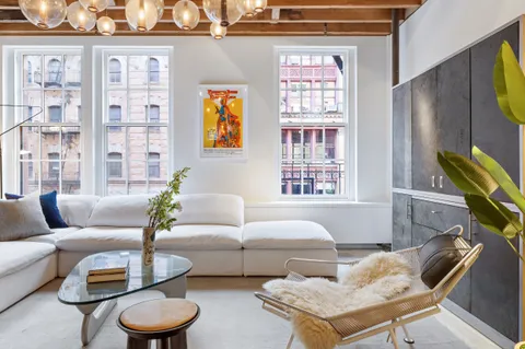 a living room with furniture and a window