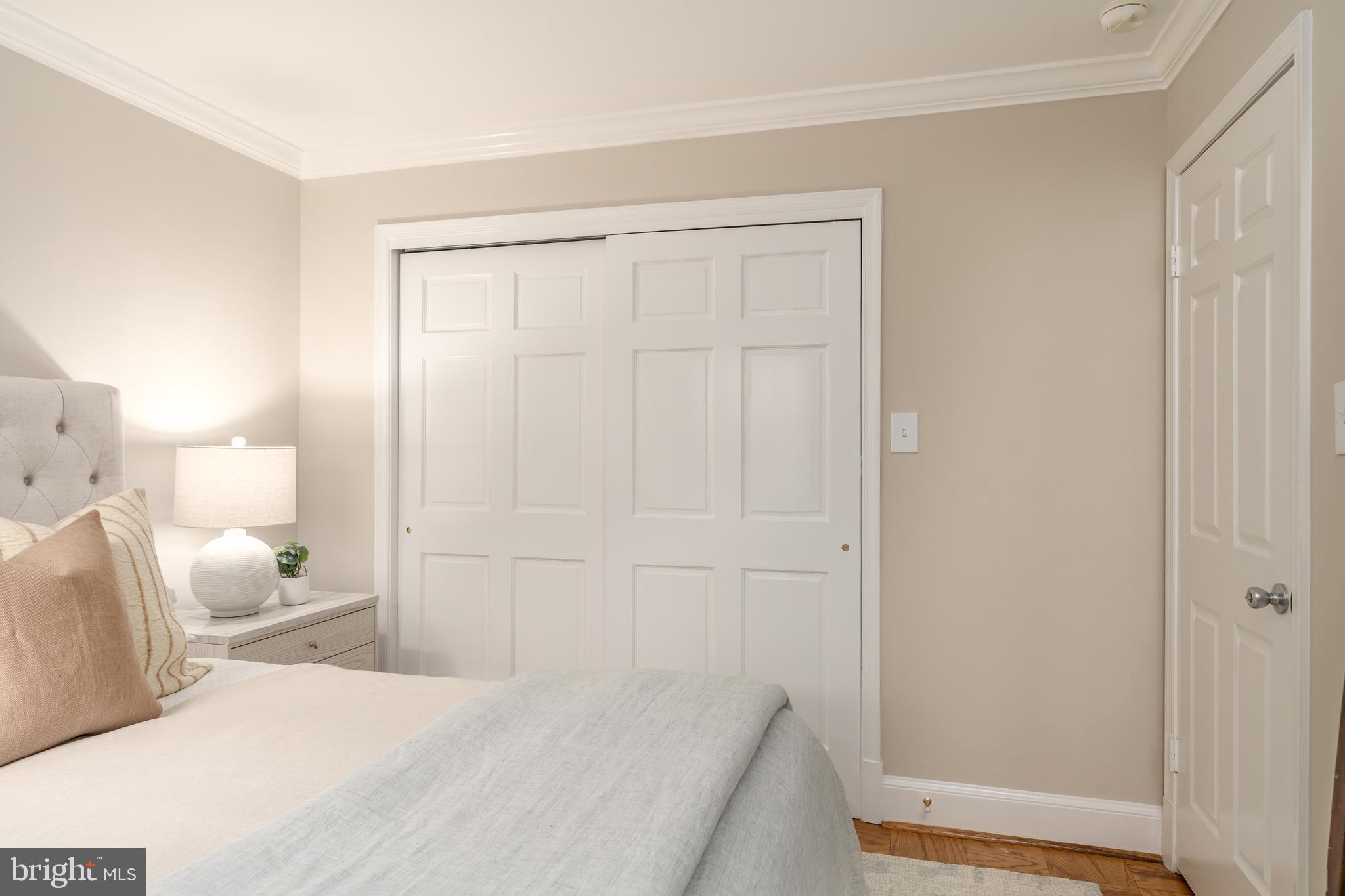 3299 Sutton Place Northwest, Unit C Washington, DC 20016 - Photo 28 of 41 a bedroom with a bed and a mirror