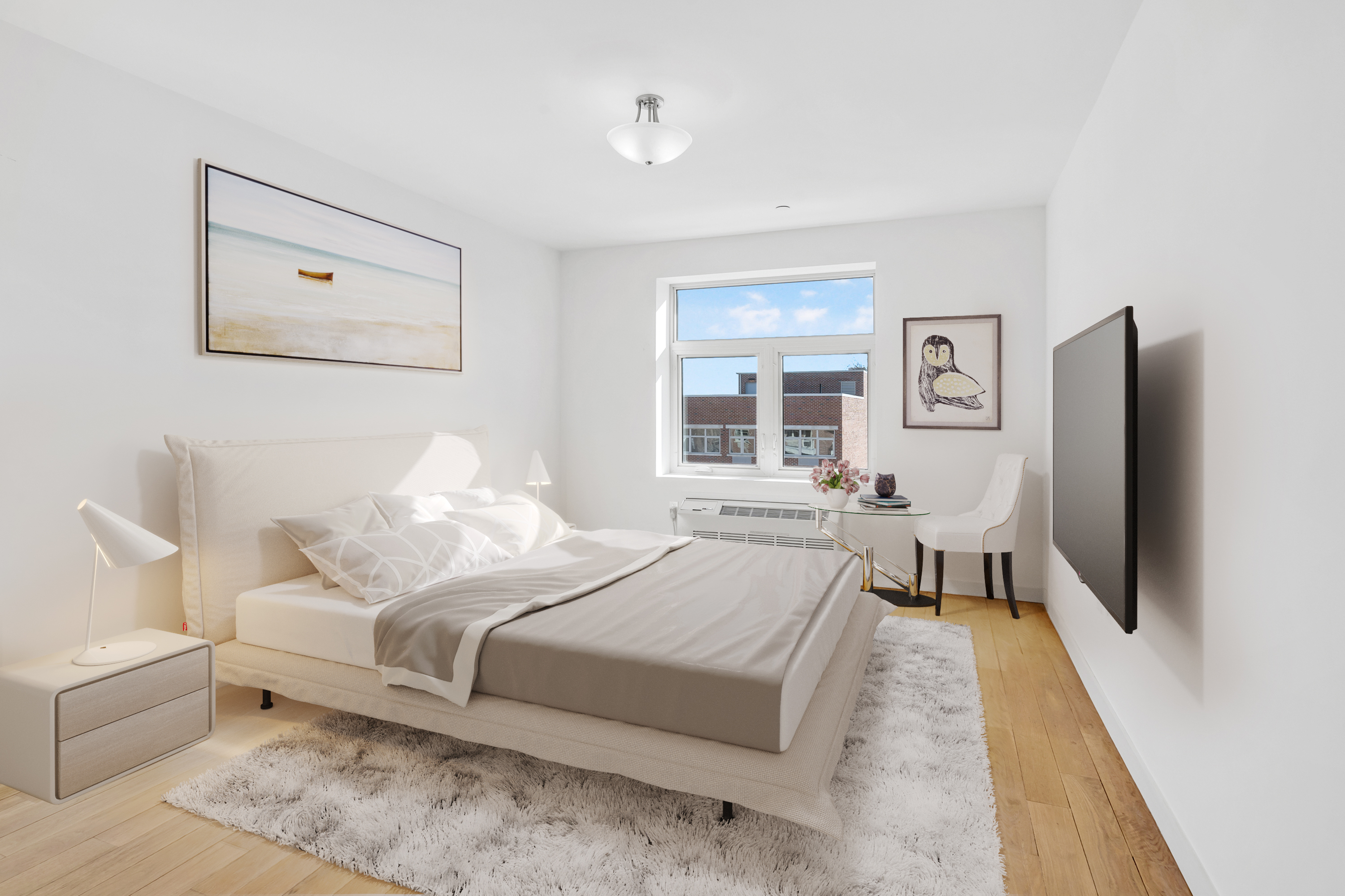 26-20 14th Place, Unit 3C Queens, NY 11102 - Photo 5 of 13 a bedroom with a bed and a flat screen tv