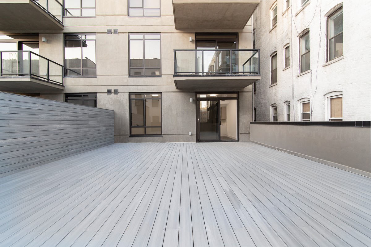 11-12 44th Drive, Unit 2B Queens, NY 11101 - Photo 3 of 15 a view of a living room with a large window