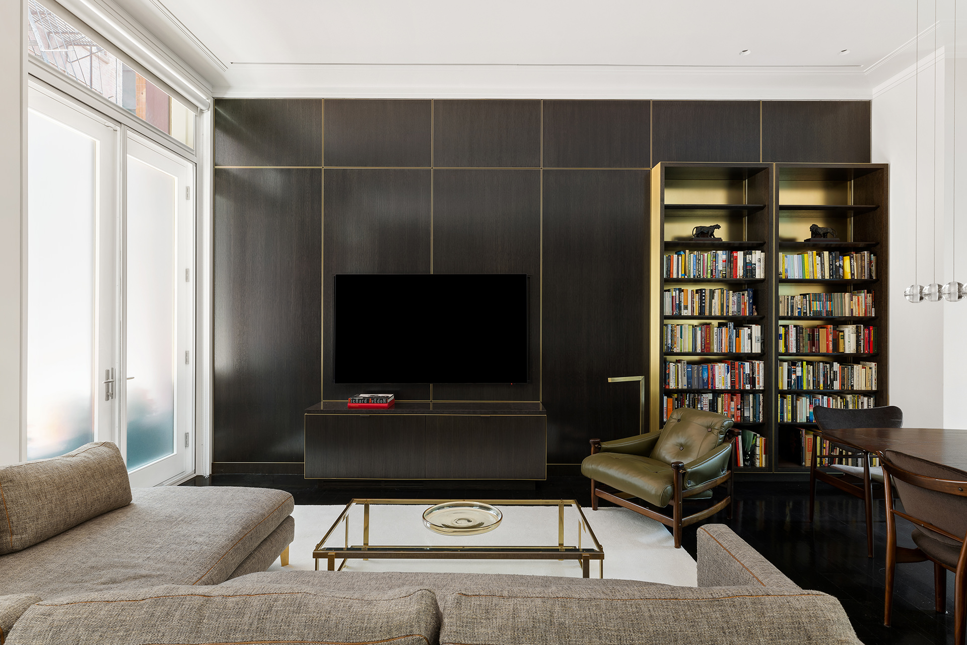 7 Harrison Street, Unit ATELIER Manhattan, NY 10013 - Photo 9 of 24 a living room with furniture and a flat screen tv