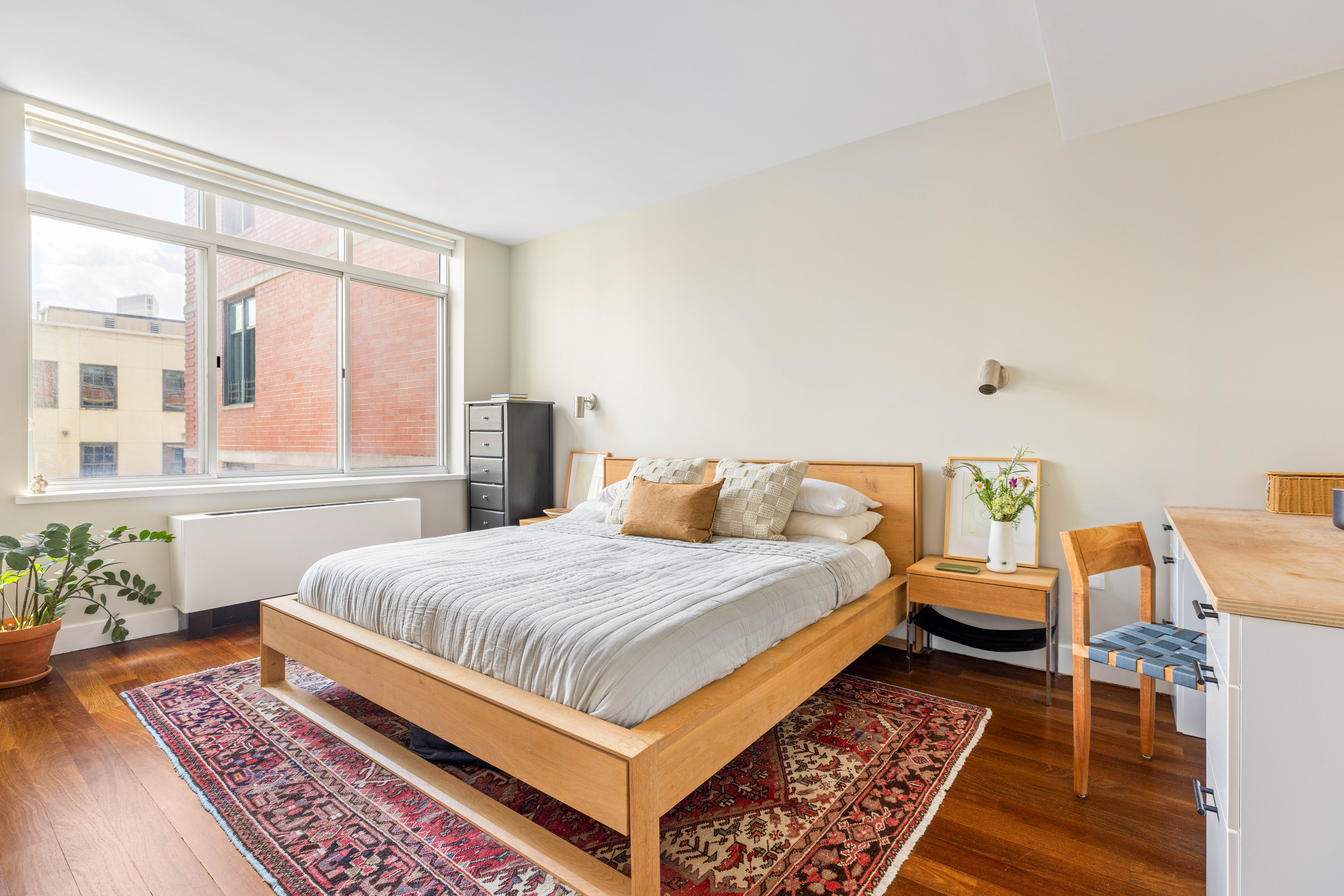 84 Front Street, Unit 8F Brooklyn, NY 11201 - Photo 6 of 12 a bedroom with a large bed and a rug