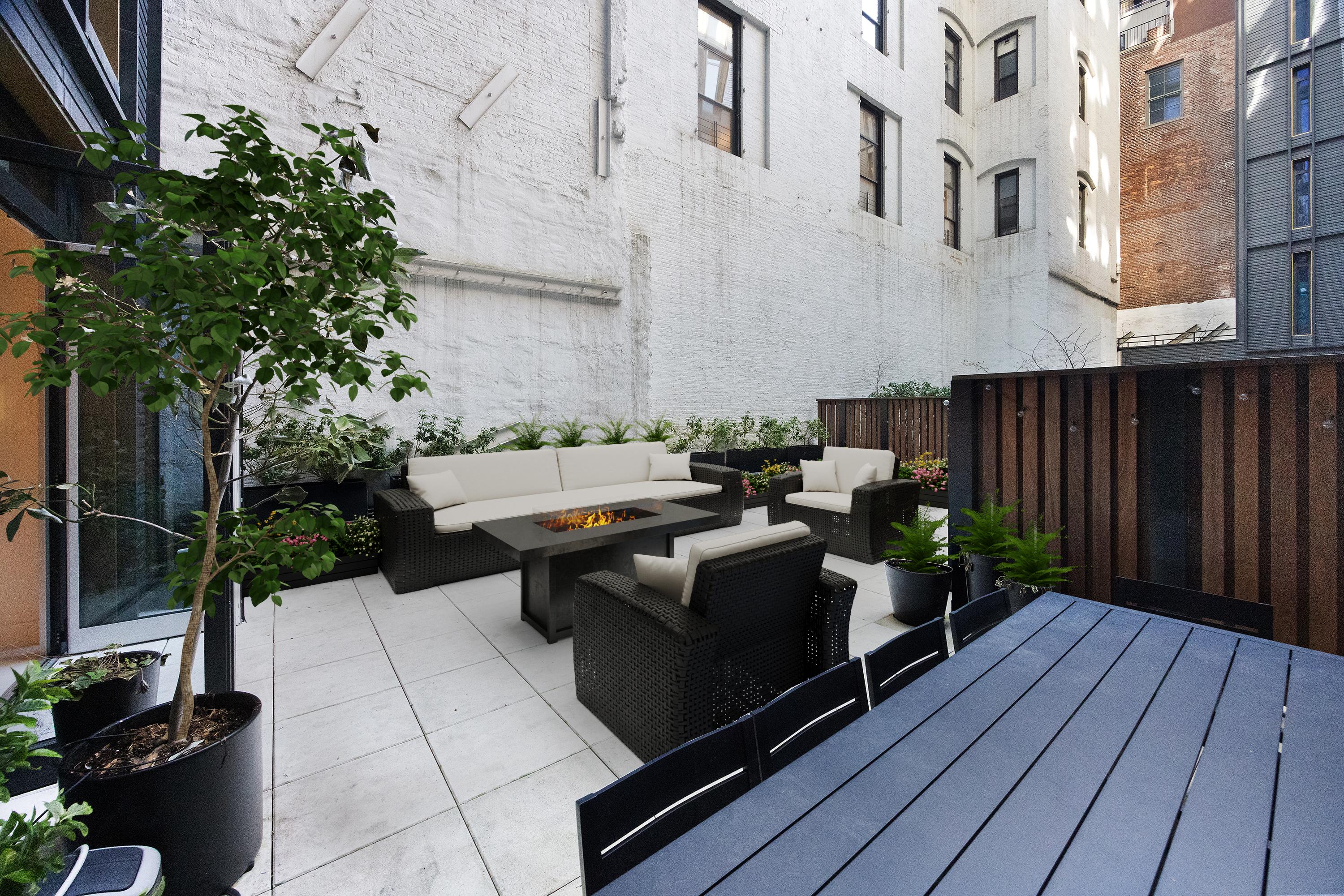 91 Leonard Street, Unit 2C Manhattan, NY 10013 - Photo 4 of 23 a view of a patio with table and chairs potted plants and wooden fence