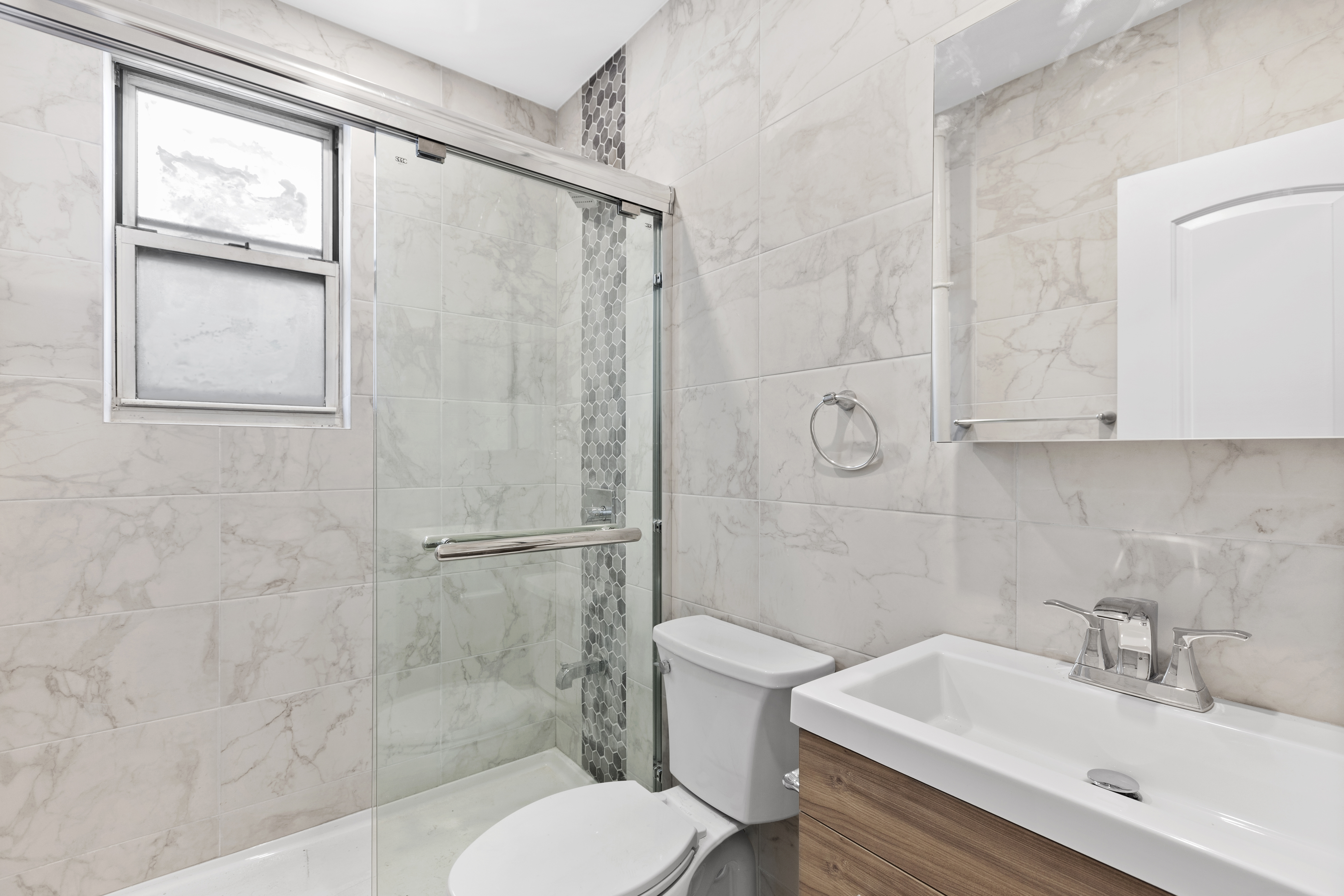 45-15 41st Street, Unit 3R Queens, NY 11104 - Photo 3 of 7 a bathroom with a sink toilet and shower