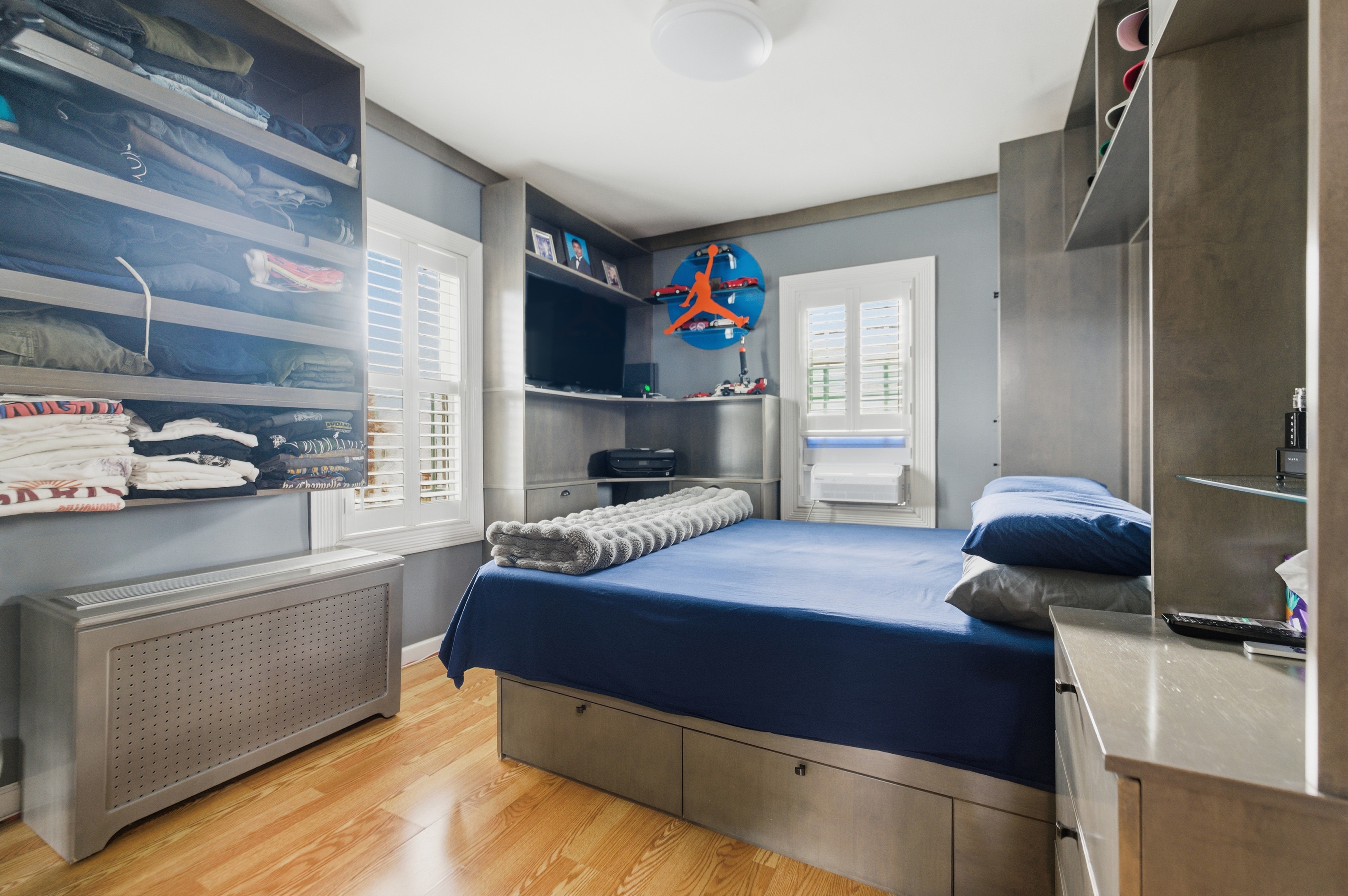 150-22 114th Road Queens, NY 11434 - Photo 6 of 22 a bedroom with a bed and a window