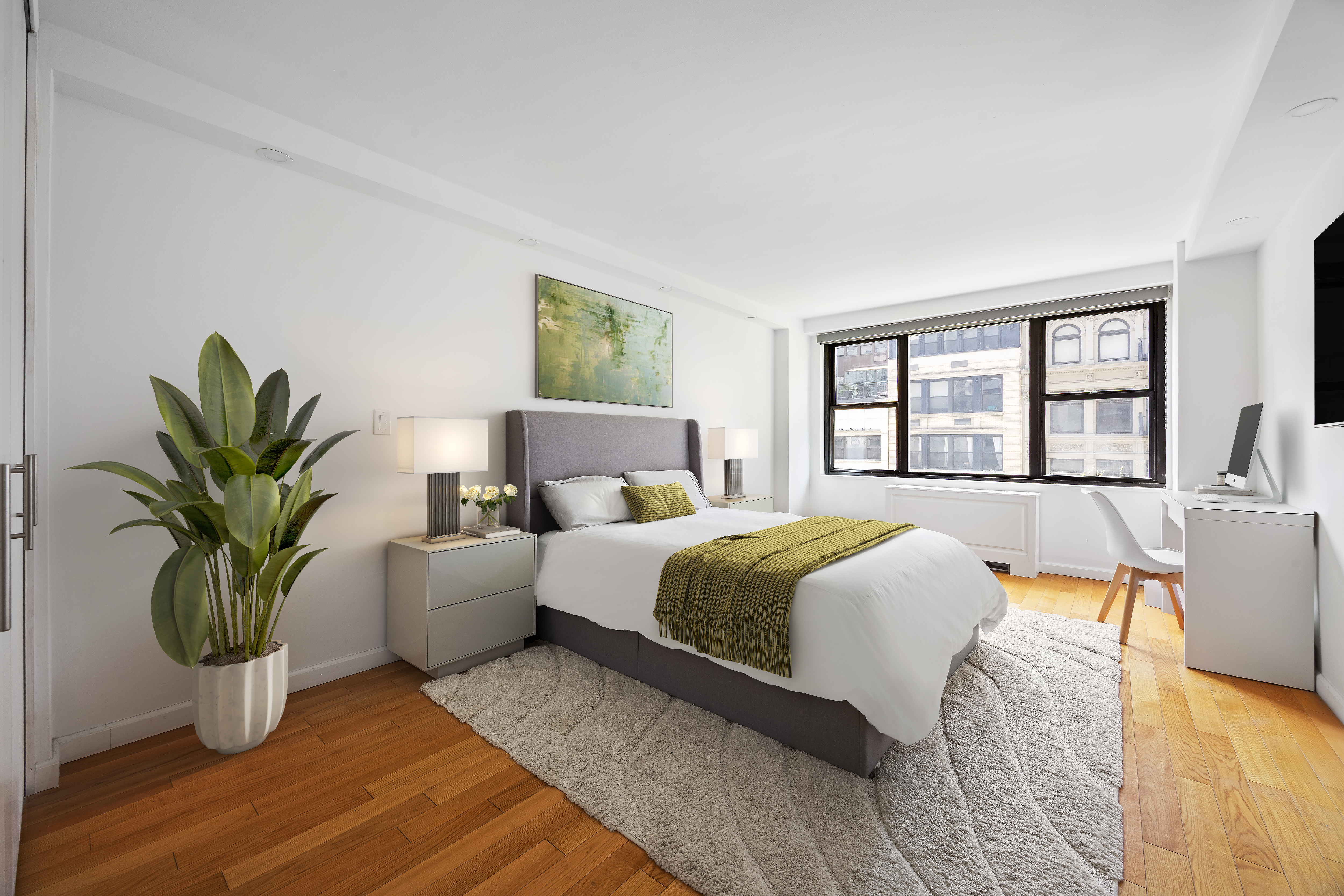 7 East 14th Street, Unit 605 Manhattan, NY 10003 - Photo 3 of 8 a bedroom with a large bed and a window