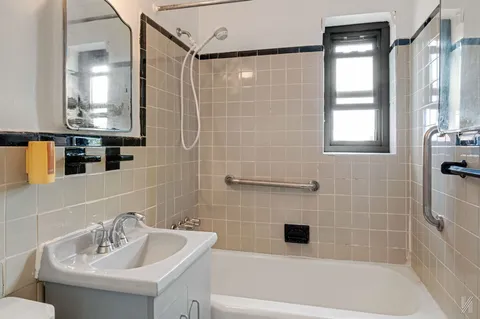 a bathroom with a sink bathtub and a shower