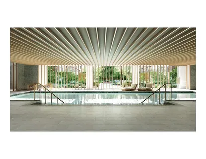 a view of a living room and a large window with kitchen view