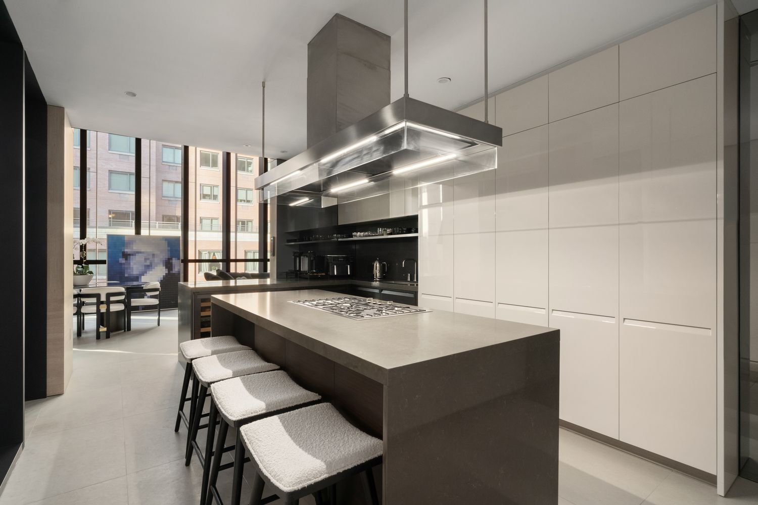 a large kitchen with a table and chairs in it