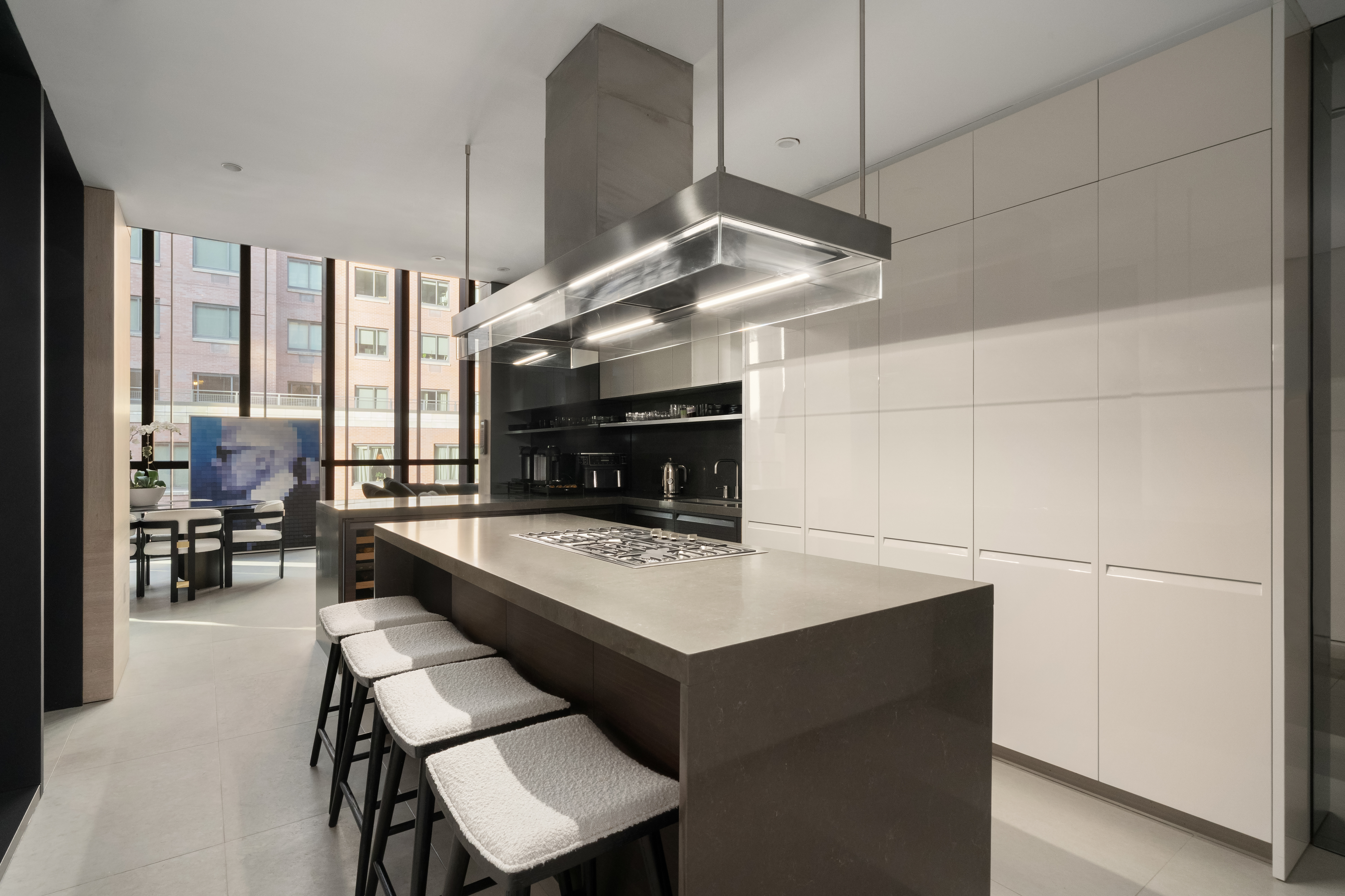 522 West 29th Street, Unit 7D Manhattan, NY 10001 - Photo 5 of 17 a large kitchen with a table and chairs in it