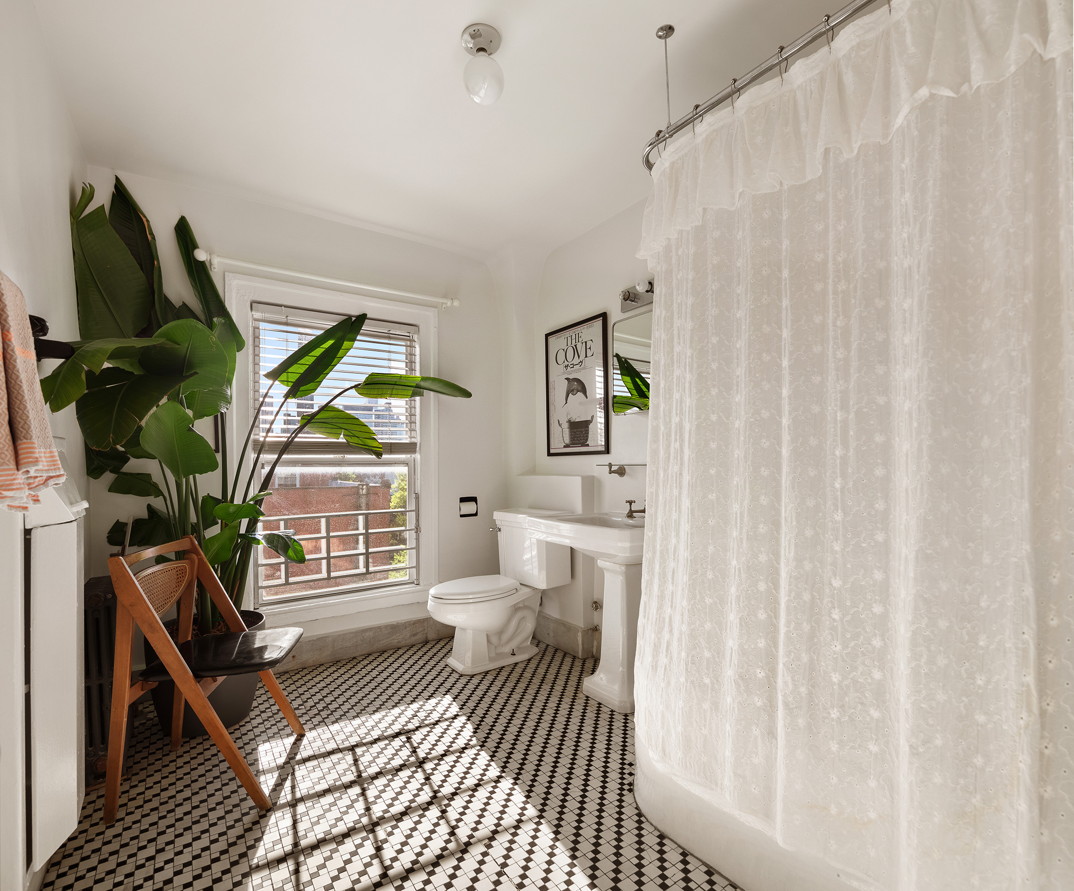 264 Clinton Avenue Brooklyn, NY 11205 - Photo 16 of 21 a living room with furniture and a floor to ceiling window