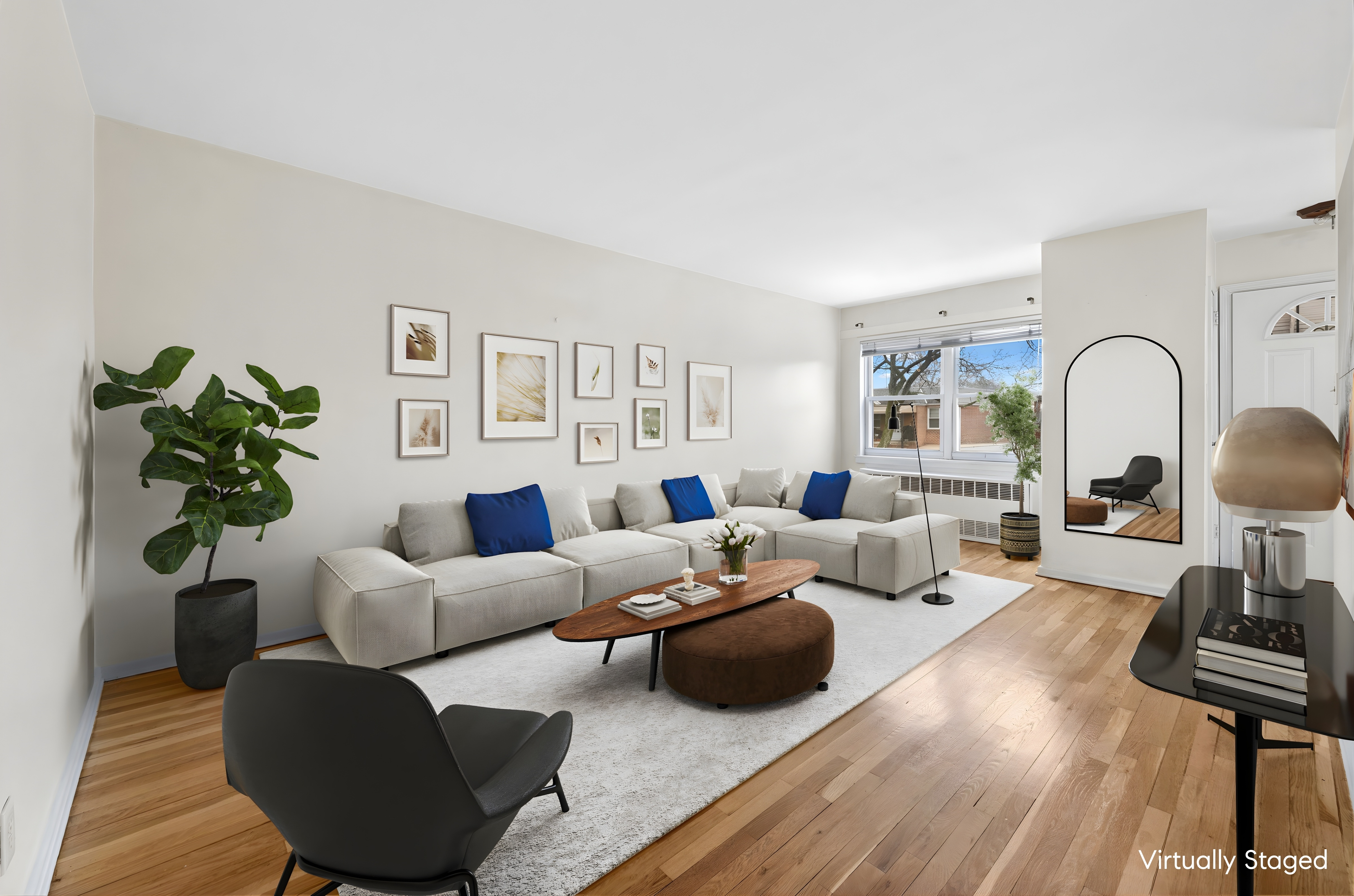 a living room with furniture potted plant and a lamp