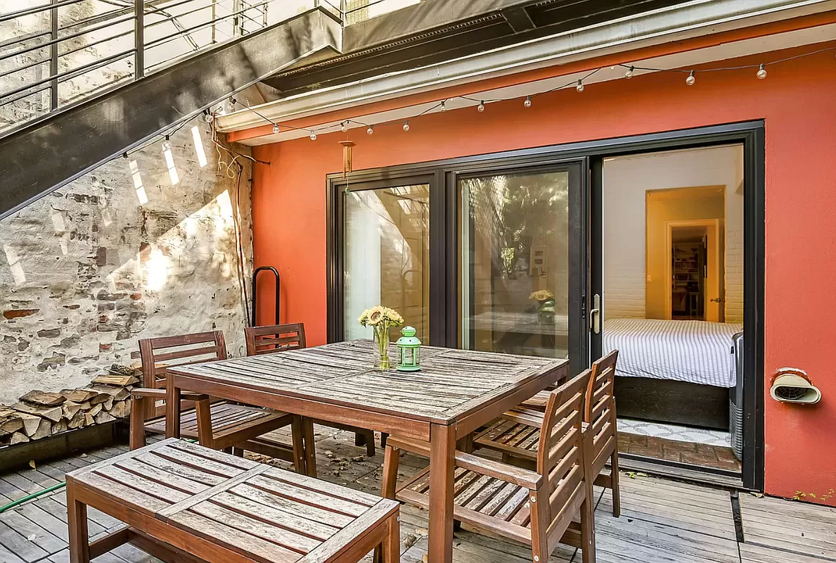 146 Berkeley Place Brooklyn, NY 11217 - Photo 20 of 21 a balcony view with a dining table and chairs with wooden floor
