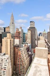 a view of city with tall buildings