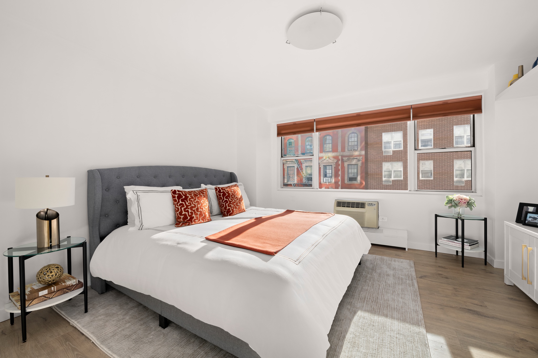 79 West 12th Street, Unit 6BC Manhattan, NY 10011 - Photo 4 of 15 a bedroom with a large bed and a large window