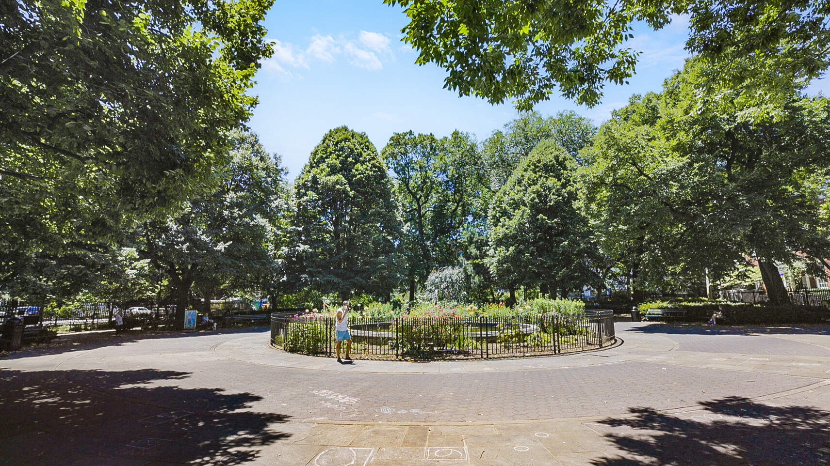 237 East 17th Street, Unit 520 Manhattan, NY 10003 - Photo 13 of 14 a view of a street with a bench and trees