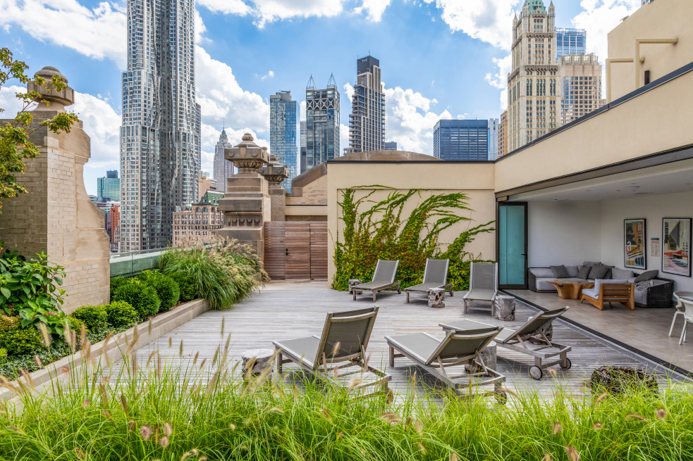 49 Chambers Street, Unit 17H Manhattan, NY 10007 - Photo 22 of 25 a view of a patio with couches table and chairs and potted plants