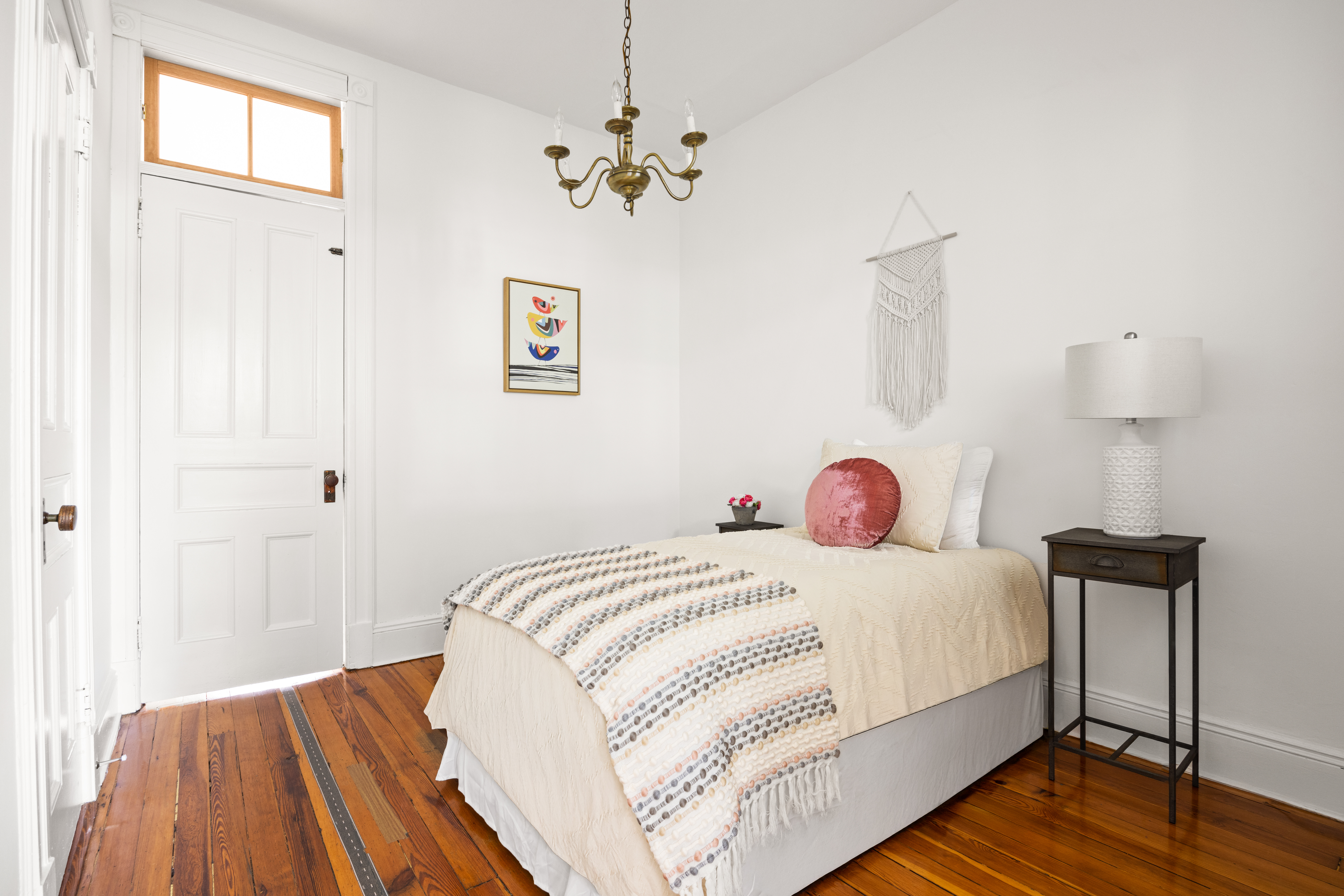 99 East 2nd Street Brooklyn, NY 11218 - Photo 15 of 24 a bedroom with a bed and wooden floor