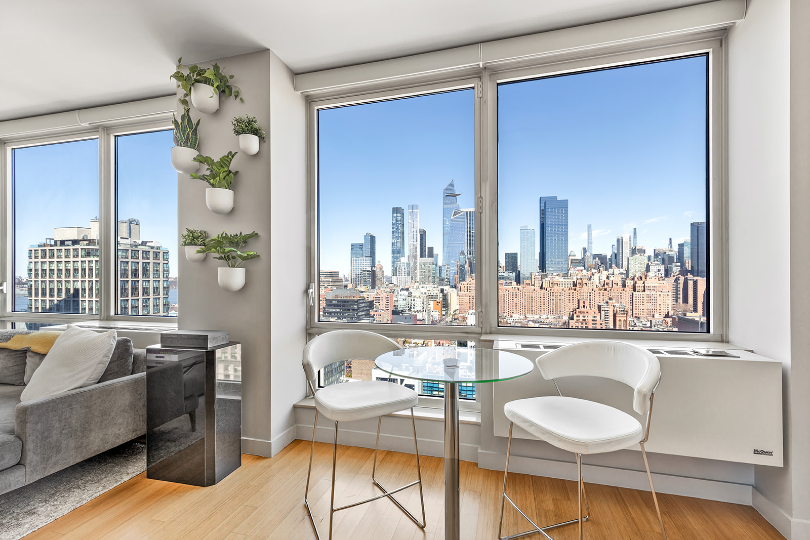 450 West 17th Street, Unit 2302 Manhattan, NY 10011 - Photo 2 of 6 a living room with furniture and a large window