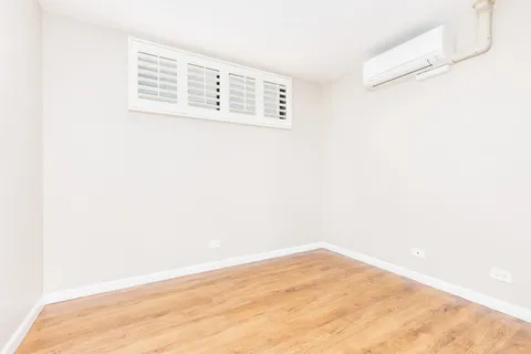 a view of a small space with wooden floor