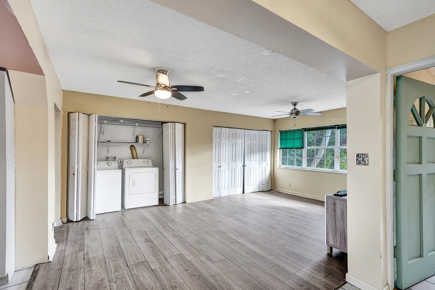 a lobby with furniture and floor to ceiling window