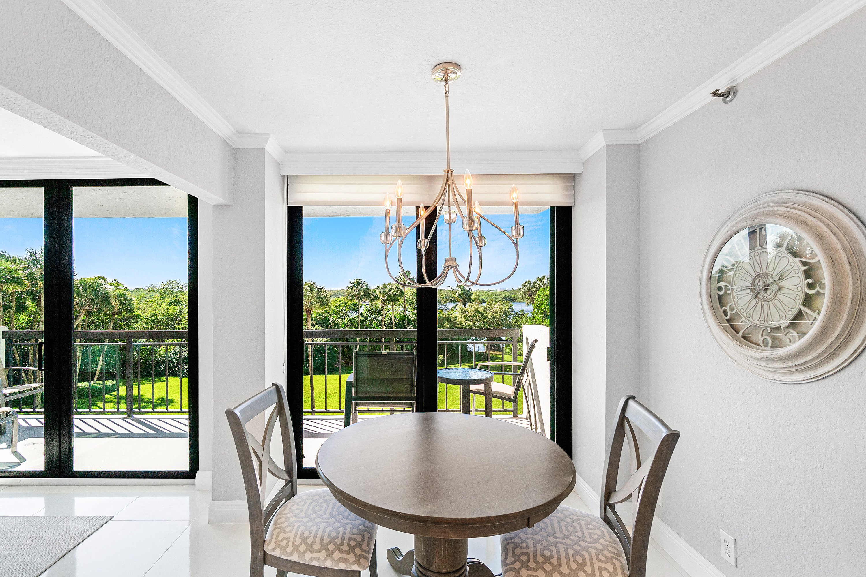 2003 North Ocean Boulevard, Unit 305 Boca Raton, FL 33431 - Photo 19 of 56 a view of a dining room with furniture window and outside view