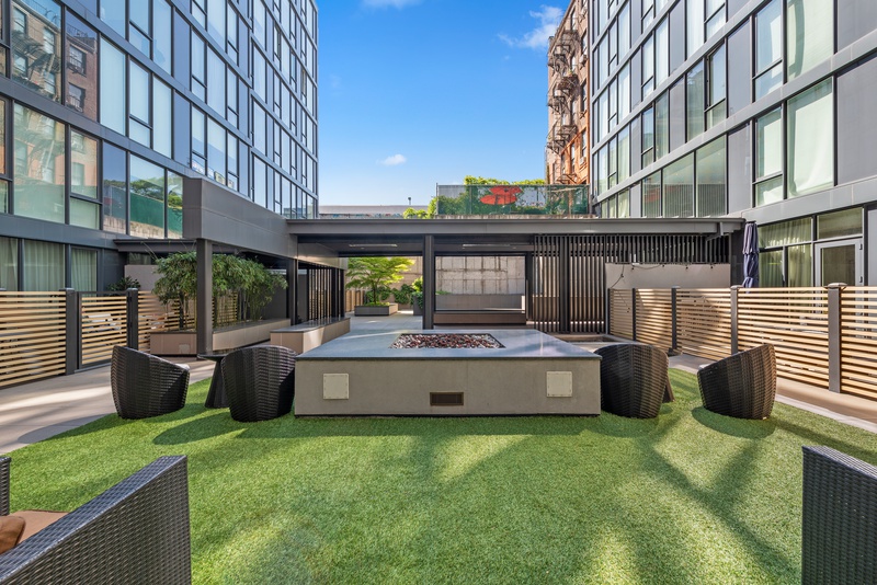 540 West 49th Street, Unit 609N Manhattan, NY 10019 - Photo 8 of 10 a view of a house with backyard and sitting area