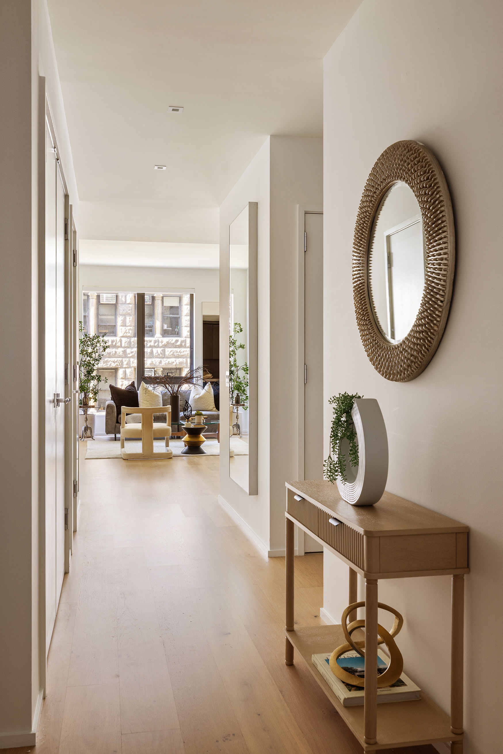 121 East 22nd Street, Unit S603 Manhattan, NY 10010 - Photo 5 of 12 a living room with furniture a mirror