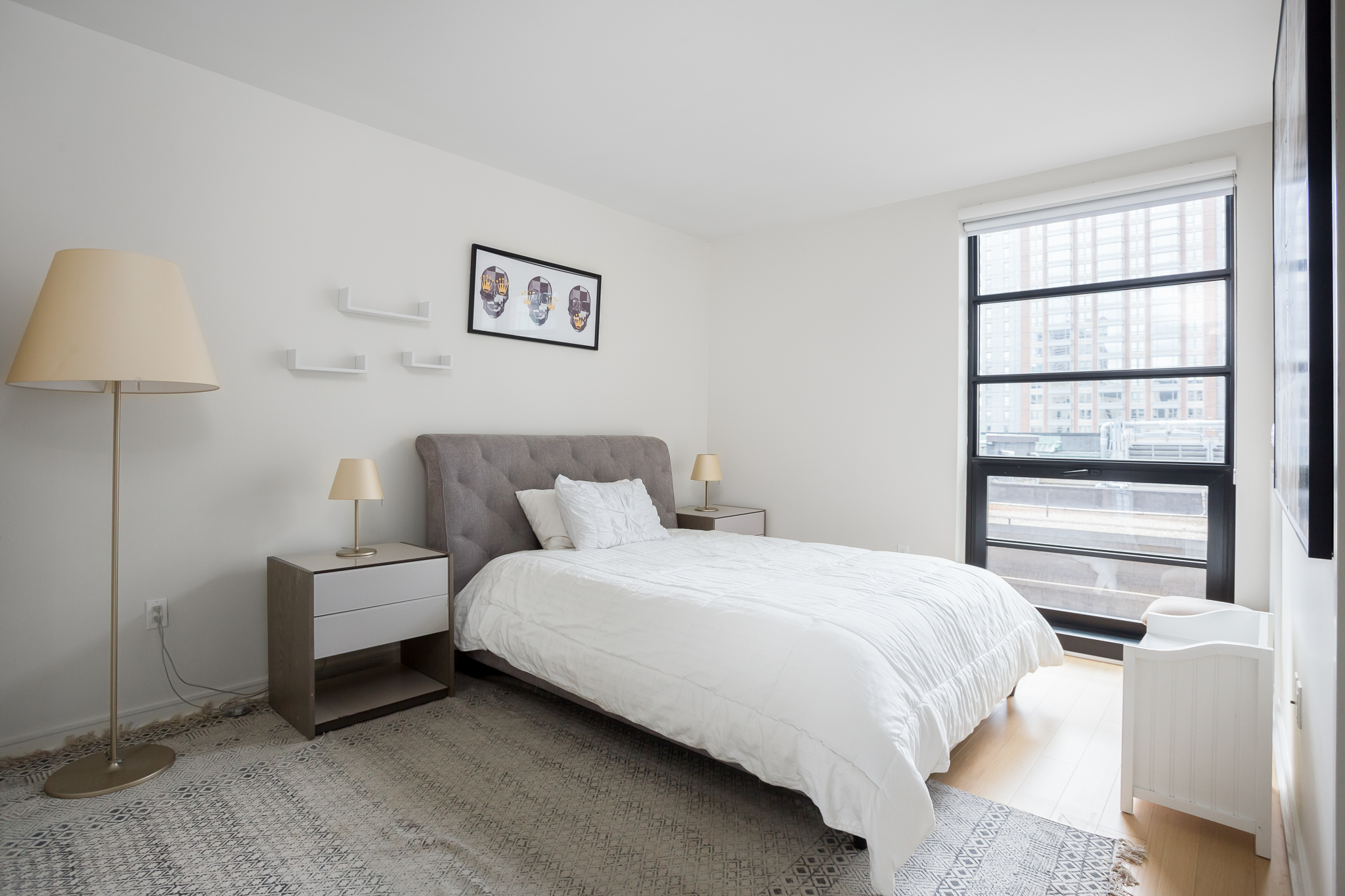 580 Washington Street, Unit 11B Boston, MA 02111 - Photo 7 of 9 a bedroom with a bed and a window