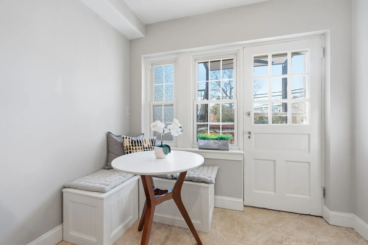 a view of a dining room that has a table and chairs in it