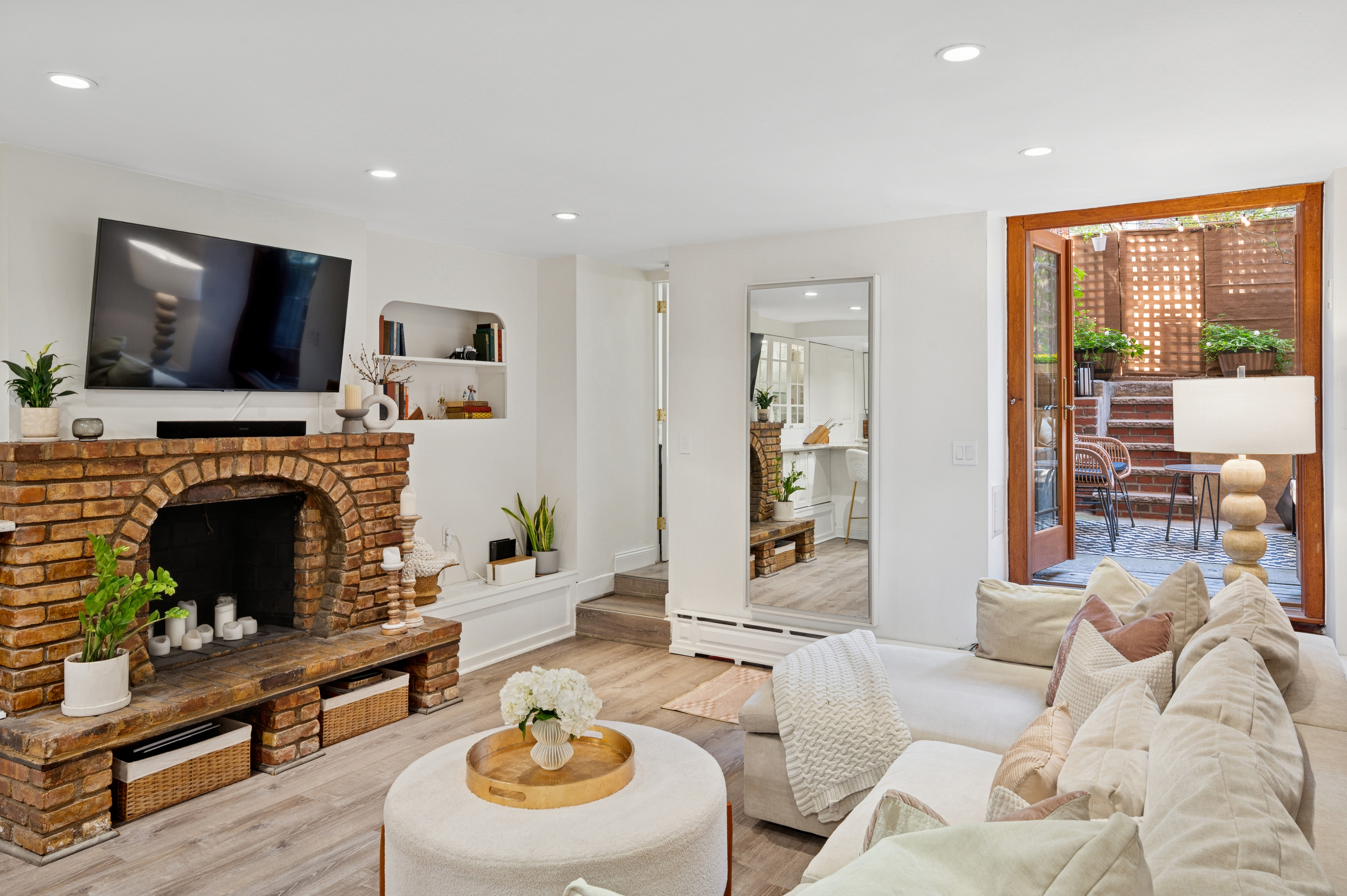 118 West 81st Street, Unit G Manhattan, NY 10024 - Photo 1 of 18 a living room with furniture a flat screen tv and a fireplace