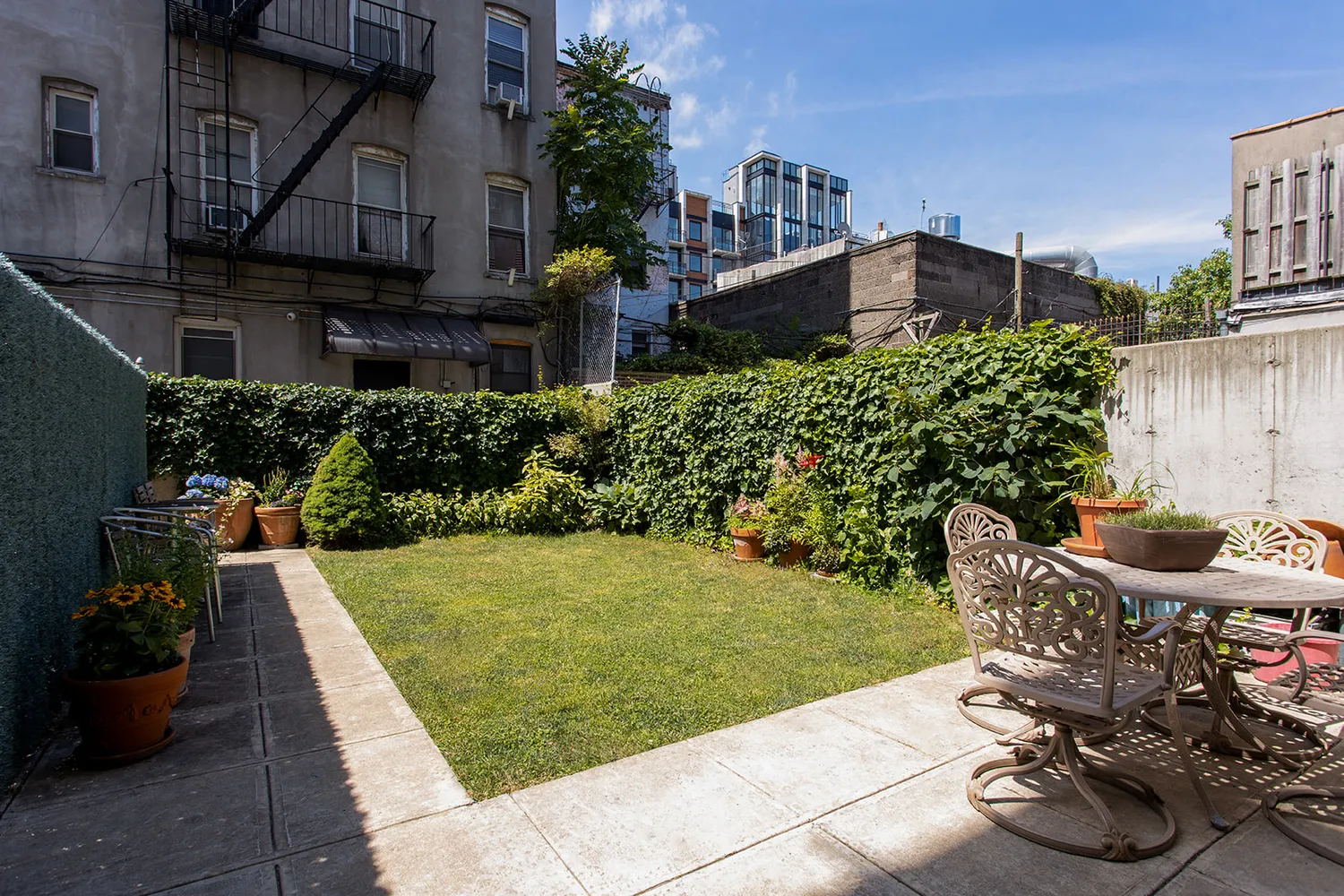 a view of backyard with patio