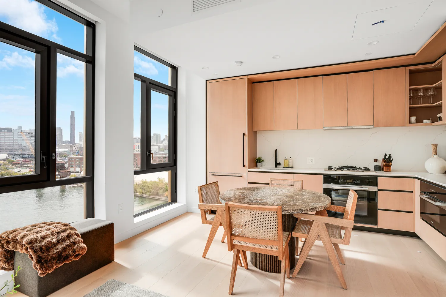 a kitchen with stainless steel appliances a stove a sink and a refrigerator