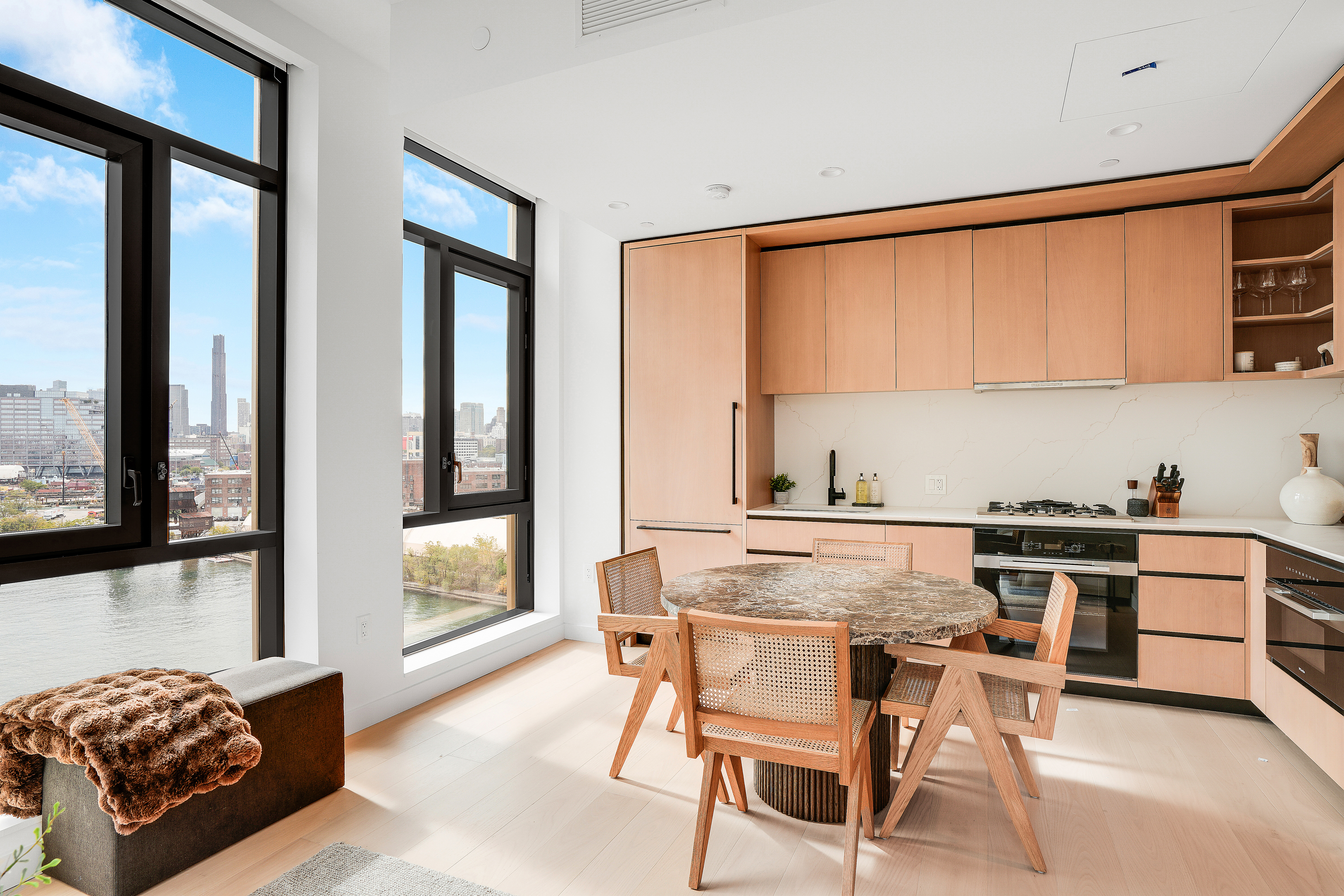 480 Kent Avenue, Unit 9A Brooklyn, NY 11249 - Photo 3 of 33 a kitchen with stainless steel appliances a stove a sink and a refrigerator