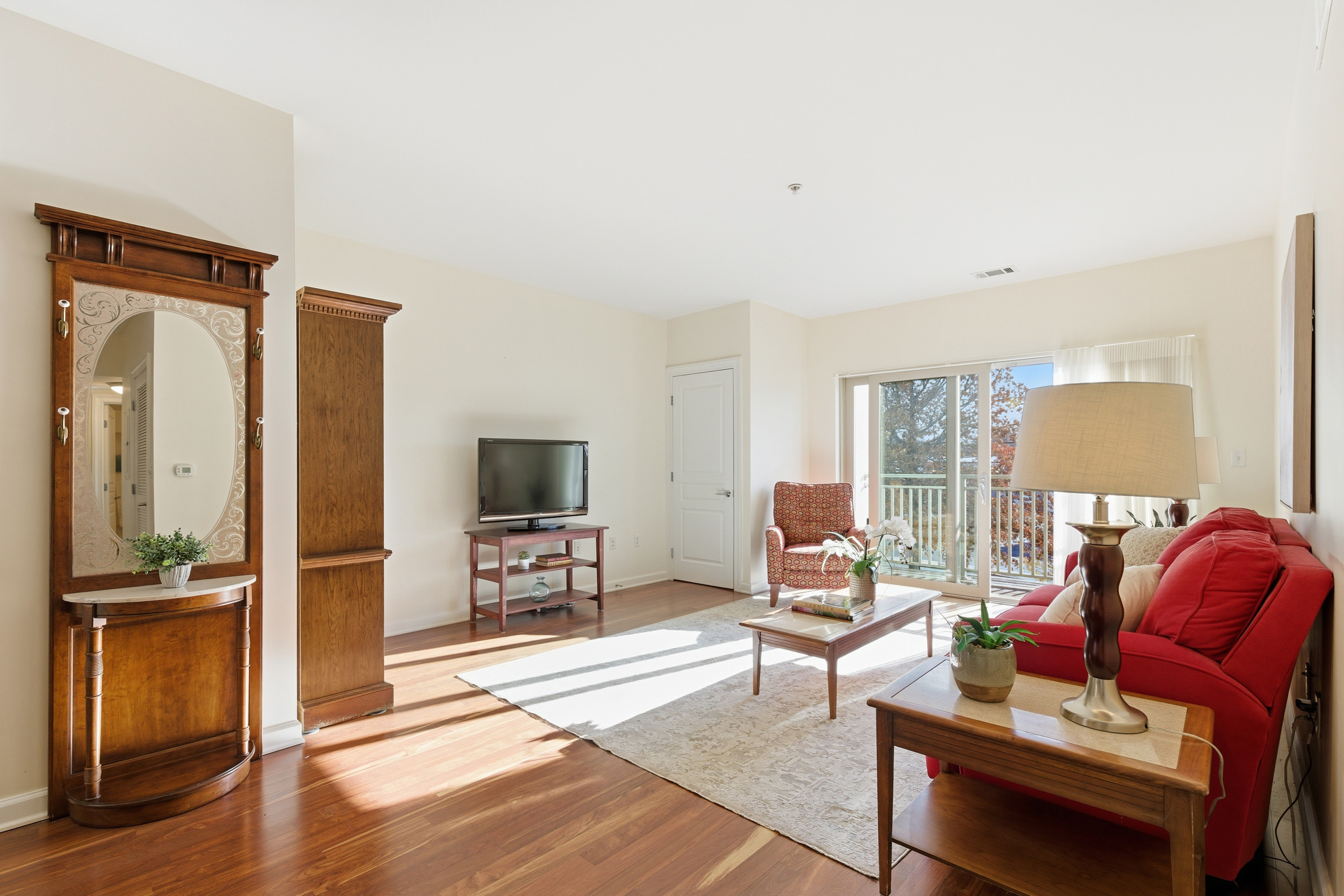 Repton Circle, Unit 3204 Watertown, MA 02472 - Photo 3 of 18 a living room with furniture and a flat screen tv