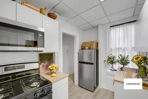 a kitchen with a stove and a refrigerator