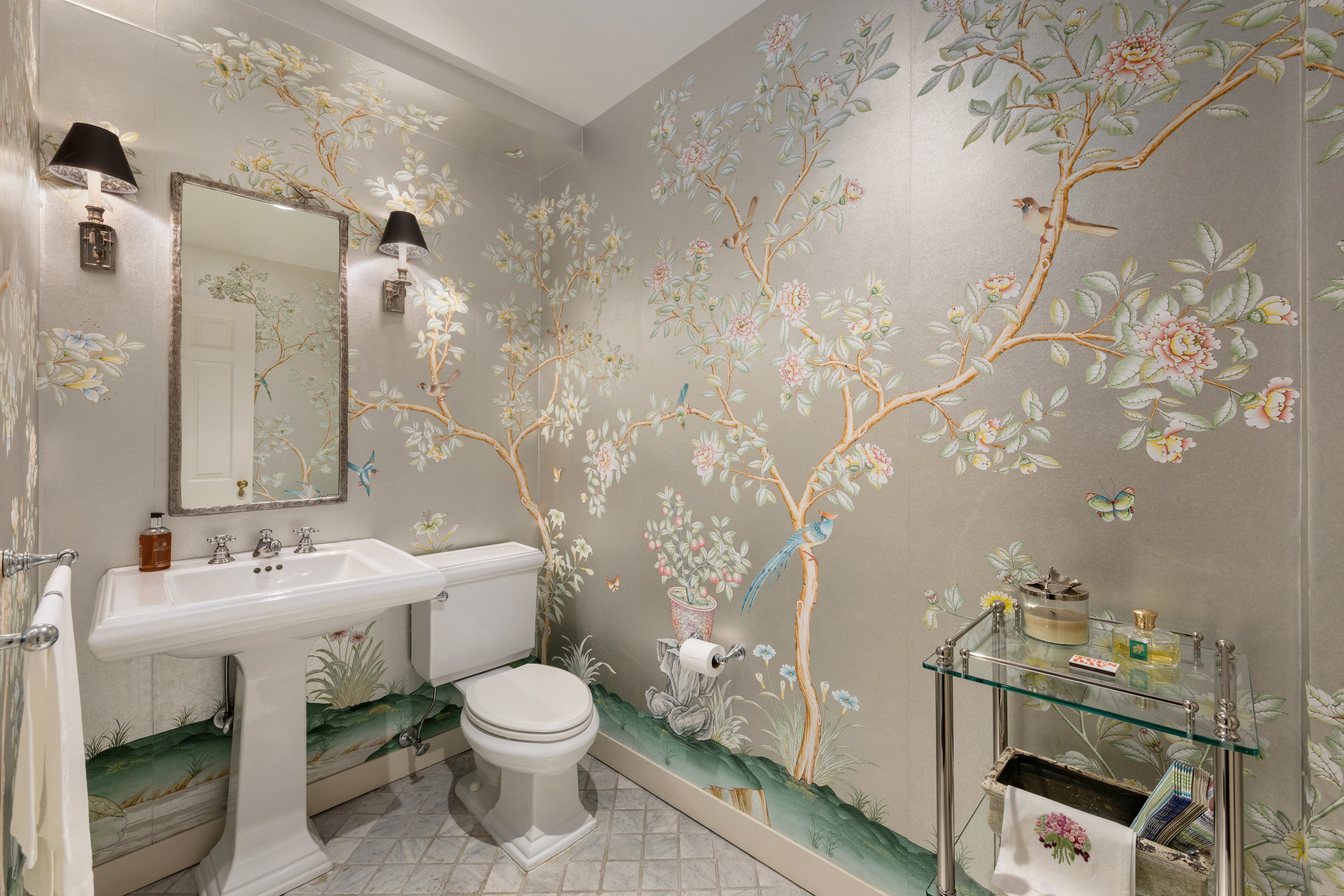 1 East 66th Street, Unit 9EF Manhattan, NY 10065 - Photo 18 of 19 a bathroom with a toilet sink and mirror