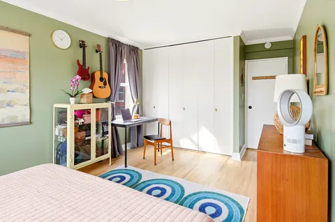 a living room filled with furniture and a table