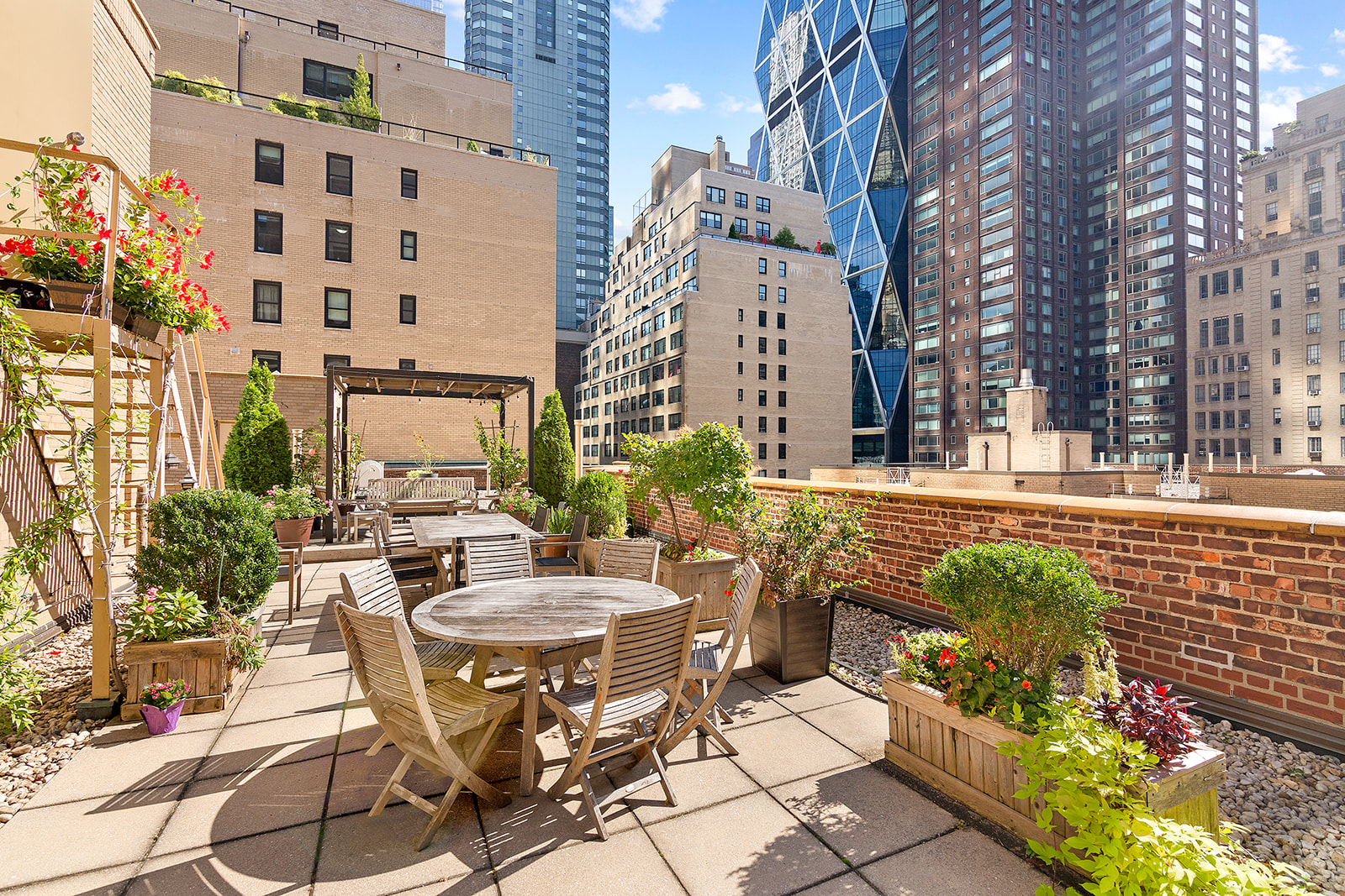 333 West 57th Street, Unit 8B Manhattan, NY 10019 - Photo 7 of 8 a view of a patio with table and chairs and potted plants