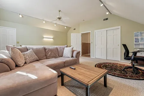a living room with furniture and a rug