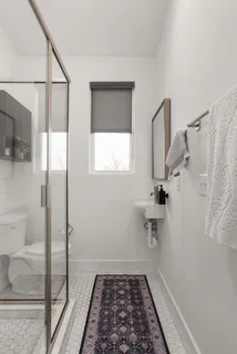 a bathroom with a sink and a shower