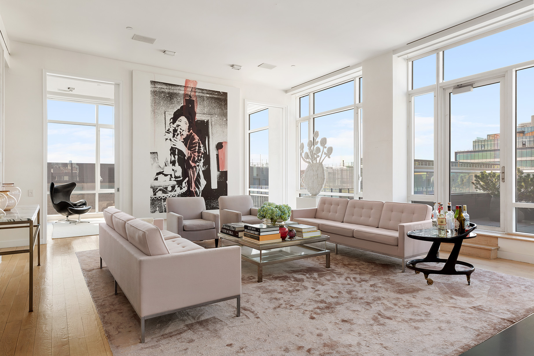 330 Spring Street, Unit PH Manhattan, NY 10013 - Photo 7 of 23 a living room with furniture and a large window