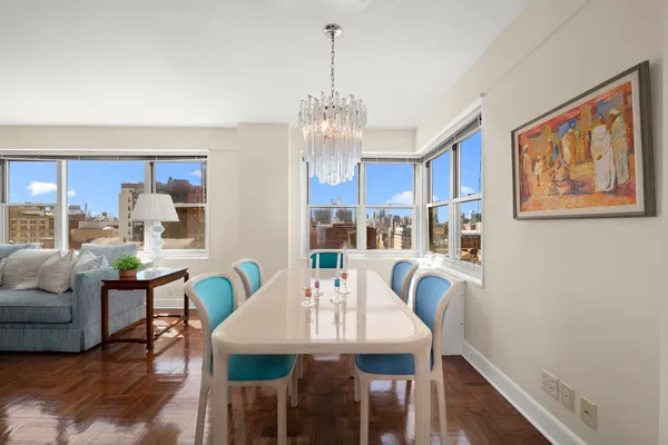 a view of a dining room with furniture window and wooden floor