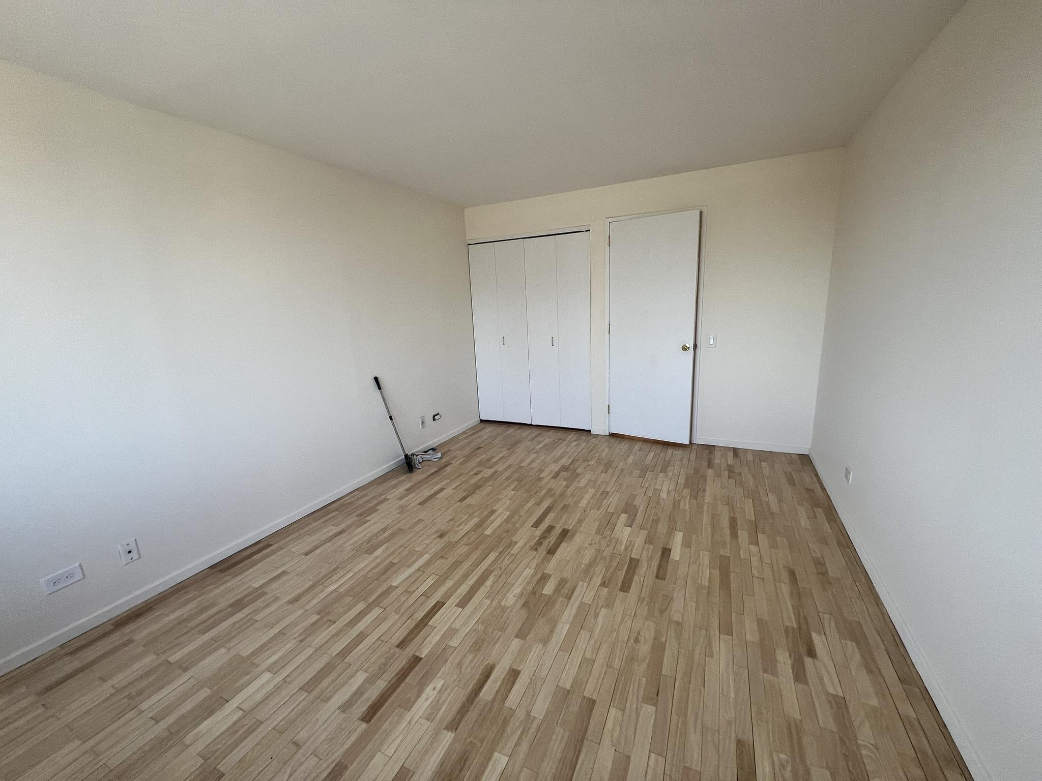 250 West 90th Street, Unit PH2F Manhattan, NY 10024 - Photo 11 of 21 a view of empty room with wooden floor