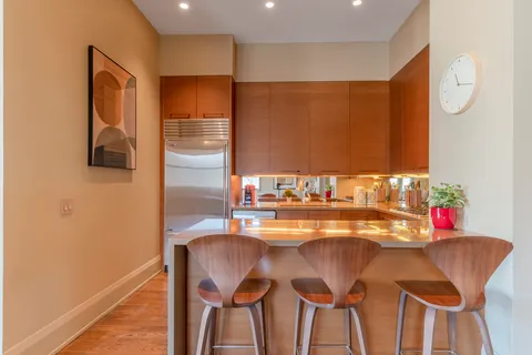 a dining room with furniture and window