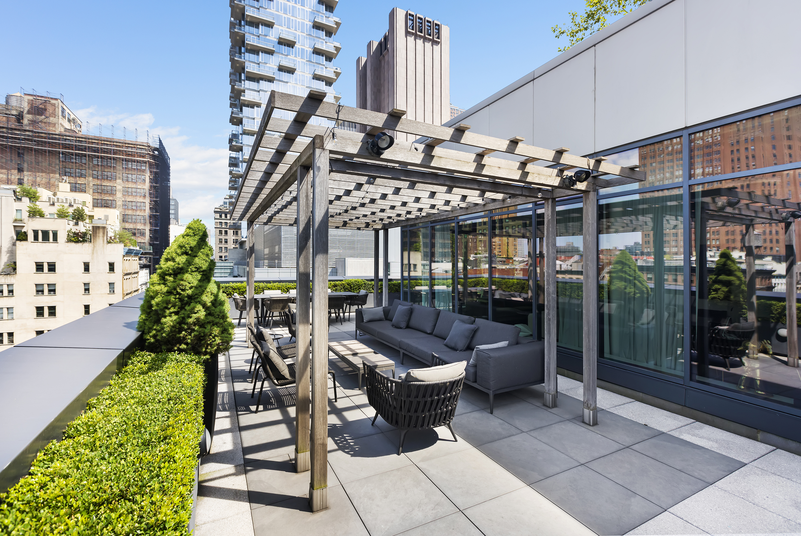34 Leonard Street, Unit PH Manhattan, NY 10013 - Photo 15 of 30 a view of a patio with couches table and chairs potted plants