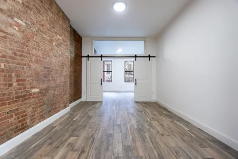 a view of wooden floor in an empty room