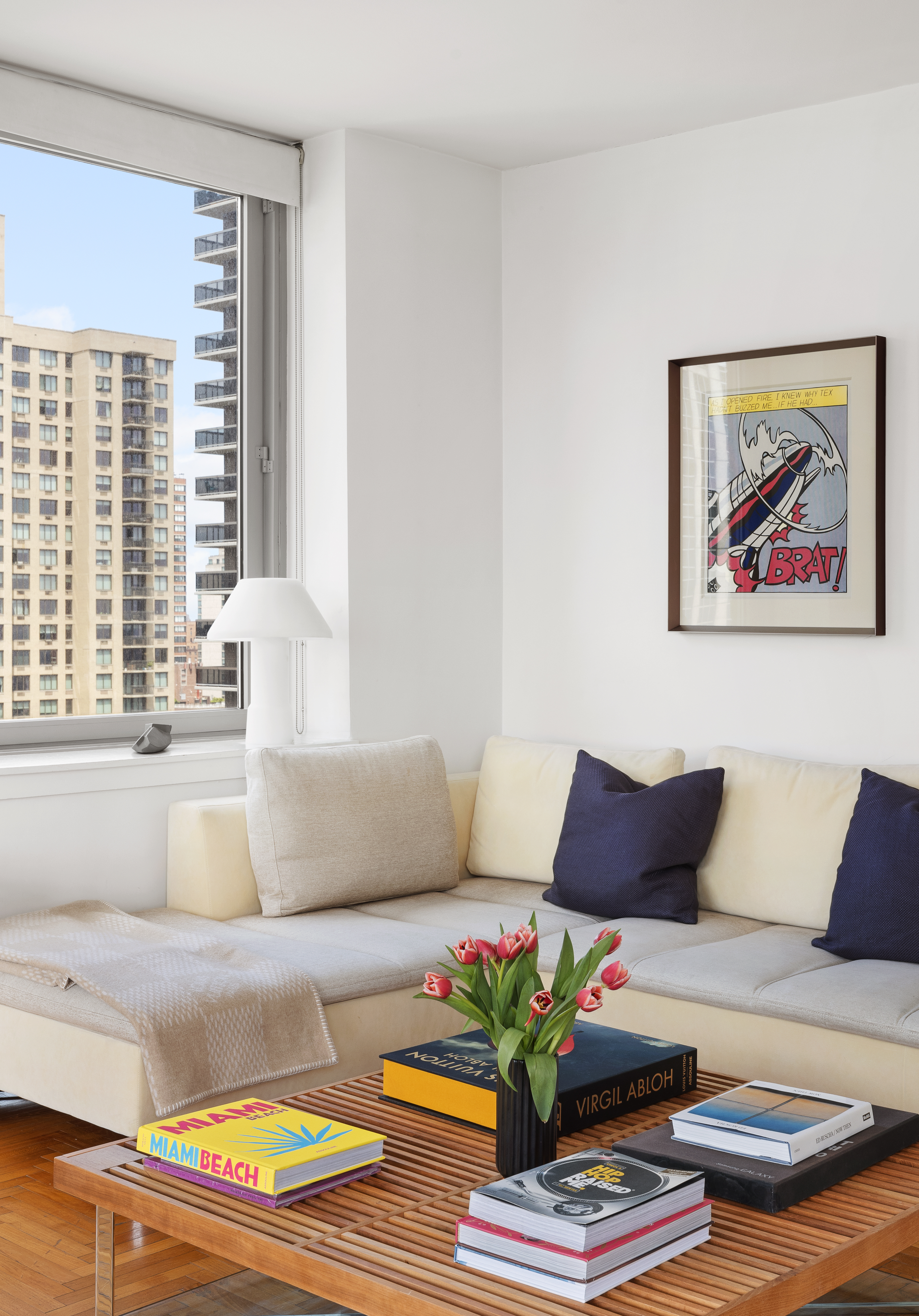 524 East 72nd Street, Unit 28DE Manhattan, NY 10021 - Photo 10 of 14 a living room with furniture and a large window